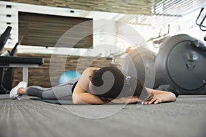 Asian woman fainting while workout photo