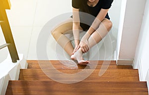 Asian woman falling down of stair,Hand female touching her legs injured