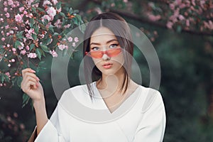 Asian woman fashion close-up portrait outdoors