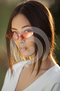 Asian woman fashion close-up portrait outdoors