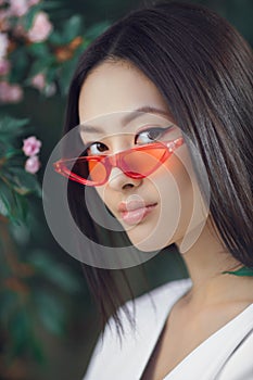 Asian woman fashion close-up portrait outdoors