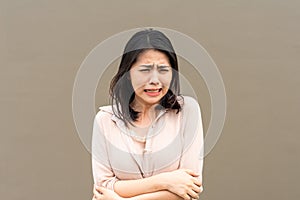 Asian woman feeling  frightened scared and shocked looking terrified