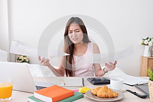 Asian woman freelancer upset with work problem with laptop on me