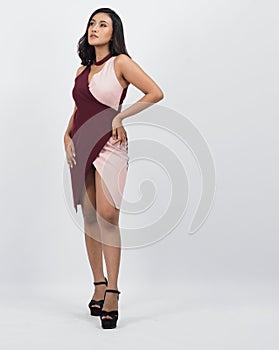 Asian woman full body. Thai woman in a modern chic style stands in white studio