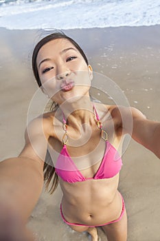 Asian Woman Girl at Beach Taking Selfie Photograph