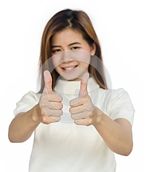 Asian woman giving her thumbs up.