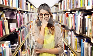 Asian woman in glasses or student at library