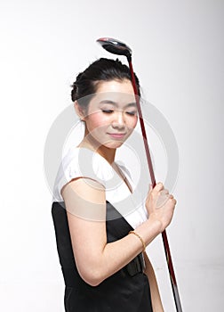 Asian woman golfing