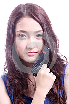 Asian woman with the gun on her hand