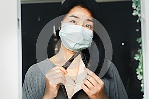 Asian woman hand open empty purse having financial problem during self-quarantine at home caused by covid-19 crisis no money for