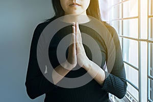 Asian woman with hand in praying position,Female pay respect or put your hands together in a prayer position