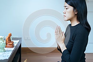 Asian woman with hand in praying position,Female pay respect or put your hands together in a prayer position