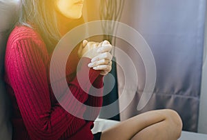 Asian woman with hand in praying position,Female prayer hands clasped together