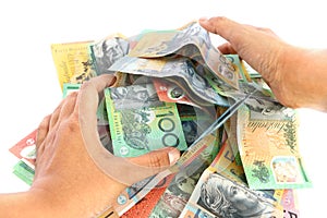 Asian woman hand taking group of colorful australian money banknote dollar AUD pile on white background