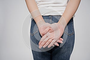 Asian woman has diarrhea holding her bum, pain in the butt, isolated on white background