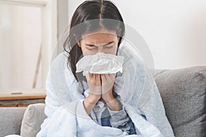 Asian woman has runny and common cold