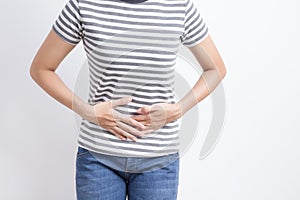 Asian woman having stomachache on white background