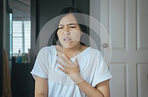 Asian woman having or symptomatic reflux acids