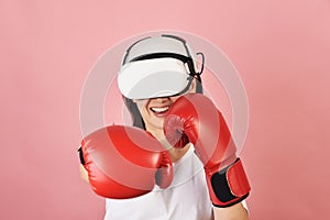 Asian woman hitting a punch by vr glasses, Working out with boxing video games application from virtual reality headset