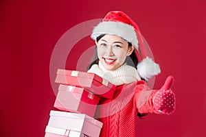 Asian woman hold christmas gifts