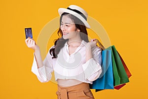 Asian woman holding creadit card and shoppingbag with mid year sale photo