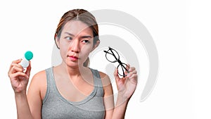 Asian woman holding glasses and contact lens on isolate on white background with clipping path, Selective focus on glasses ,