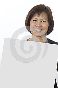 Asian woman holding placard for text