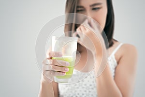 Asian woman holding a smelly garbage juice.