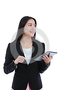 Asian woman holding tablet computer, isolated on white background, working on touching screen.