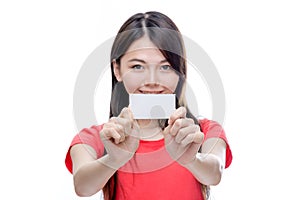 Asian woman holding up blank business card