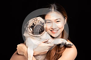 Asian woman hugging dog pud breed with love happiness photo