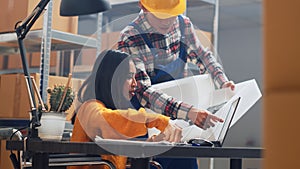 Asian woman with impairment looking at packages