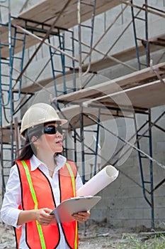 Asian Woman Inspector on construction site