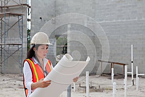 Asian Woman Inspector on construction site