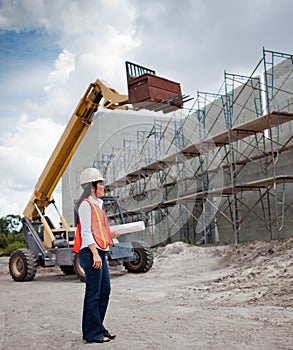 Asian Woman Inspector on construction site