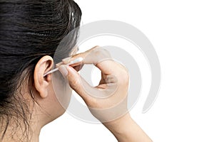 Asian woman with an itchy ears cleaning,removing the earwax in her auditory canal,lady girl using a cotton swab to clean her ear