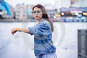 Asian woman in Jean jacket