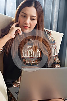 Asian woman Laptop Working Planning Thinking Concept