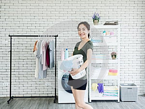 Asian woman in laundry room