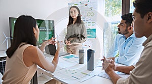 Asian woman lead young group of multiethnic businesspeople in team meeting, using laptop computer for ESG topic presentation