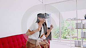 Asian woman lifestyle at home with Thai friend. Social distancing. Wearing virtual reality headset