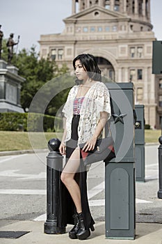 Asian Woman in lifestyle locations standing in front of Capital building in Austin, Texas