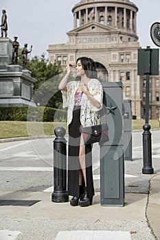 Asian Woman in lifestyle locations standing in front of Capital building in Austin, Texas