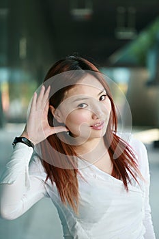 Asian woman listening gossip close up