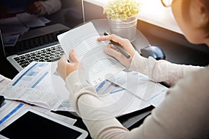 Woman calculating her Debt.