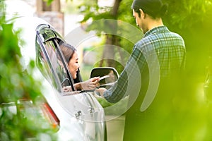 Asian woman making contactless payment with credit card