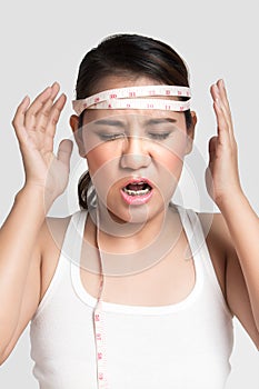 Asian woman measuring his head