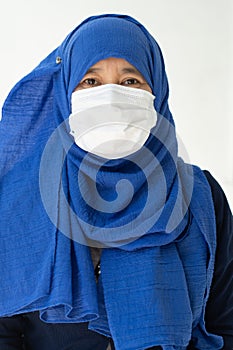 Asian woman in medical mask Coronavirus pandemic disease isolate background. COVID-19 virus from Malaysia epidemic outbreak to