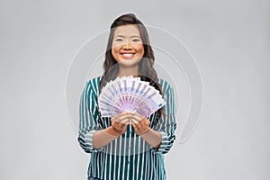 Asian woman with money banknotes of thousands euro