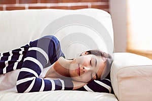 Asian woman napping on the couch